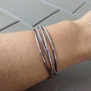 Women's silver tone wire cuff bracelet.